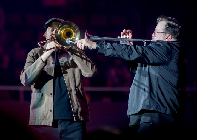 Newsong's Russ Lee, right, and Billy Goodwin team pu on the trumpet and trombone during the Winter Jam 2024 tour Thursday, March 14, 2024 at the Peoria Civic Center.