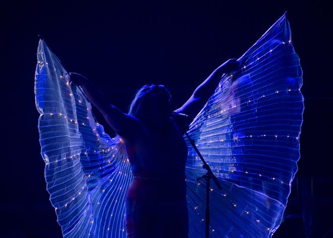 Madison Cain Johnson of the Christian country pop trio CAIN sports a set of lighted angel wings during the Winter Jam 2024 tour Thursday, March 14, 2024 at the Peoria Civic Center.