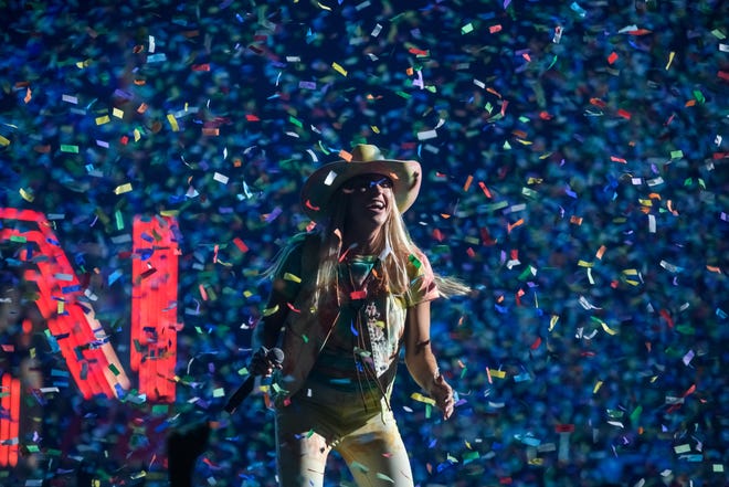 Taylor Cain Matz of the Christian group CAIN smiles as confetti falls during the Winter Jam 2024 tour Thursday, March 14, 2024 at the Peoria Civic Center.