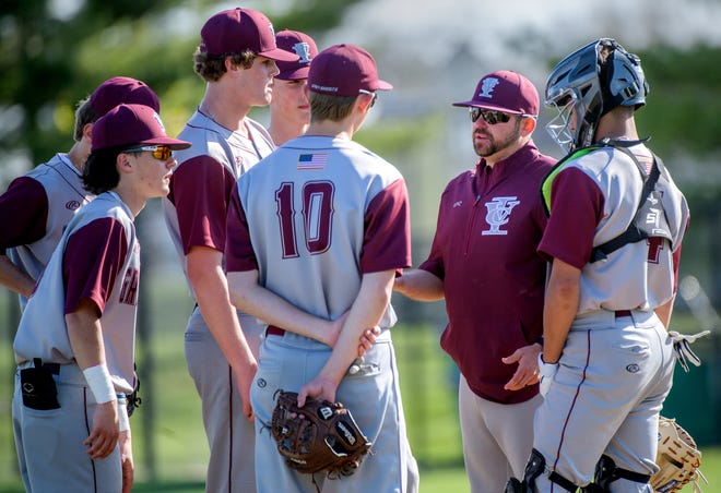 IVC baseball coach Josh Hoffer talks with his infield as they battle Dunlap on Tuesday, April 9, 2024 in Dunlap.