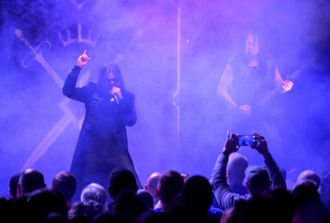 Queensrÿche lead singer Todd La Torre, left, works the crowd as guitarist Michael Wilton performs Wednesday, April 10, 2024 at the Peoria Civic Center Theater.