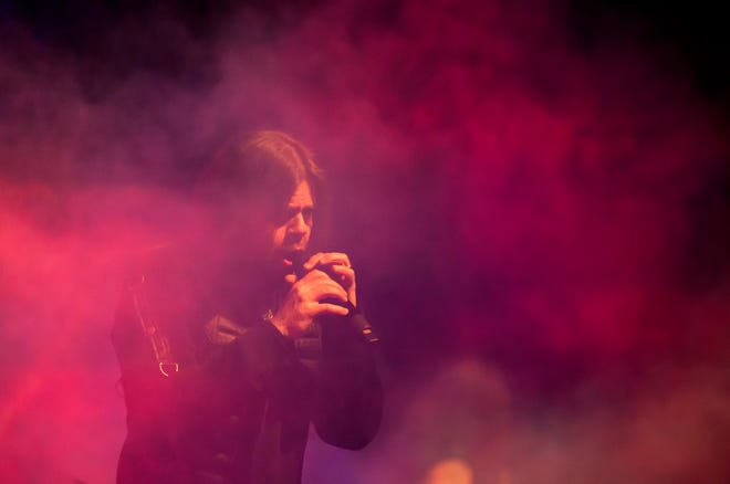 Queensrÿche's Todd La Torre sings through a red mist during their performance Wednesday, April 10, 2024 at the Peoria Civic Center Theater.