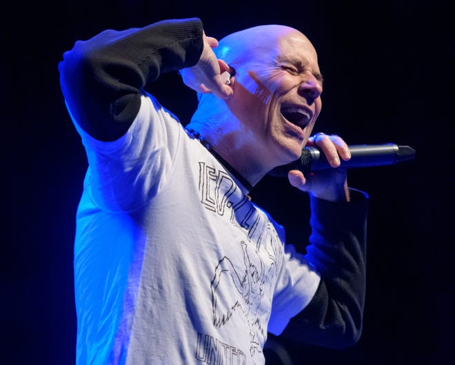 Lead singer John Bush of Armored Saint tries to hear the crowd during their performance Wednesday, April 10, 2024 at the Peoria Civic Center Theater.