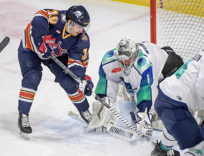 Peoria's Mathew Rehding (10) makes a move against Pensacola goaltender Stephen Mundinger in the first period of Game 2 of the first round of the SPHL playoffs Saturday, April 13, 2024 at the Peoria Civic Center. The Rivermen advanced to the semifinals with a 6-1 victory.