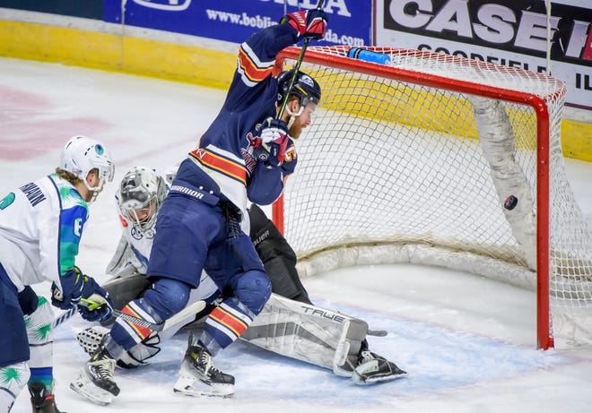 Peoria's Alec Hagaman watches the puck sail into the net past Pensacola goaltender Stephen Mundinger in the first period of Game 2 of the first round of the SPHL playoffs Saturday, April 13, 2204 at the Peoria Civic Center. The Rivermen advanced to the semifinals with a 6-1 victory.