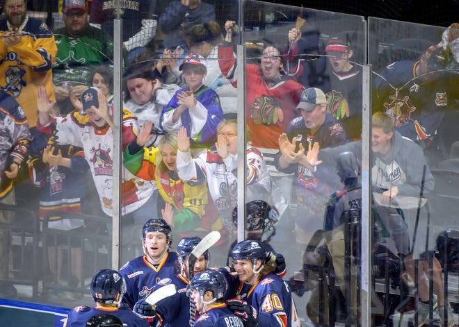 Fans pound on the glass as the Rivermen celebrate JM Piotrowski's goal against Pensacola in the third period of Game 2 of the first round of the SPHL playoffs Saturday, April 13, 2024 at the Peoria Civic Center. The Rivermen advanced to the semifinals with a 6-1 victory.