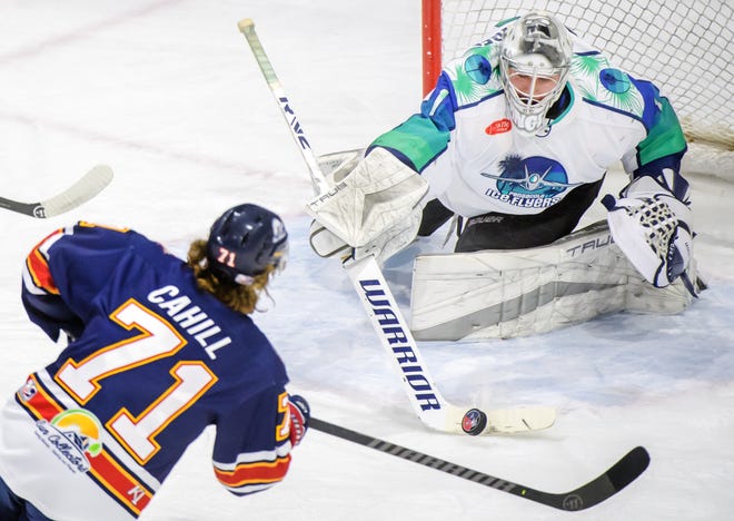 Pensacola goaltender Stephen Mundinger knocks the puck away from Peoria's Cayden Cahill in the first period of Game 2 of the first round of the SPHL playoffs Saturday, April 13, 2024 at the Peoria Civic Center. The Rivermen advanced to the semifinals with a 6-1 victory.