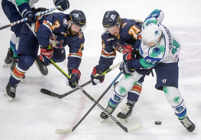 Peoria's Joe Drapluk (7) and Cayden Cahill (71) tangle with Pensacola's Ivan Bondarenko in the second period of Game 2 of the first round of the SPHL playoffs Saturday, April 13, 2024 at the Peoria Civic Center. The Rivermen advanced to the semifinals with a 6-1 victory.
