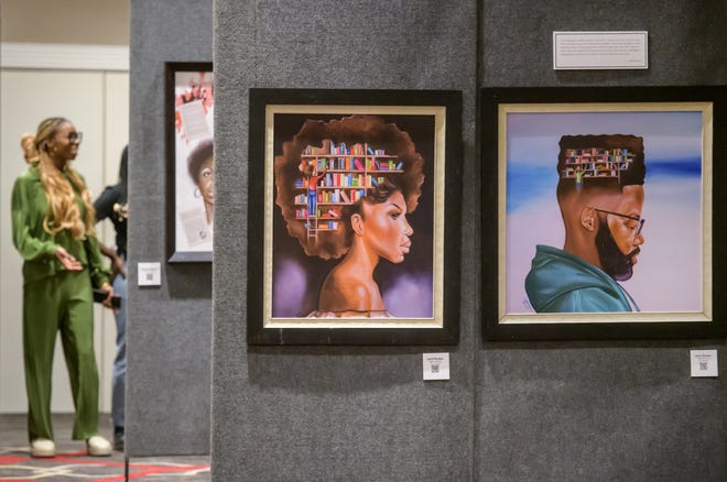 Two pieces by artist Jamil Burton, one entitled "Higher Learning" on the left and the other "Fight the Power" hang in the "Change That Narrative" free art show and book release event Saturday, April 13, 2024 at Four Points by Sheraton in downtown Peoria.