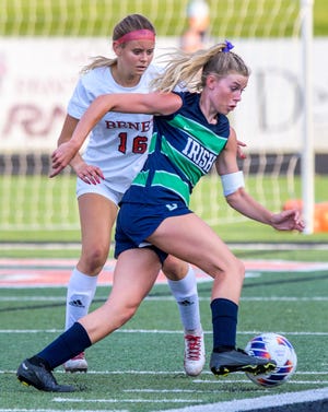 Peoria Notre Dame's Mya Wardle, foreground, moves the ball around Benet Academy's Bailey Abbott during their Class 2A supersectional soccer match Tuesday, May 30, 2023 in Washington.